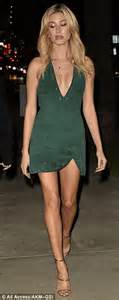 hailey baldwin flaunts cleavage in a plunging minidress at