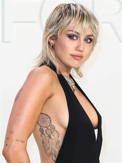 Miley Cyrus Braless Sexy Boobs At Tom Ford Fashion Show