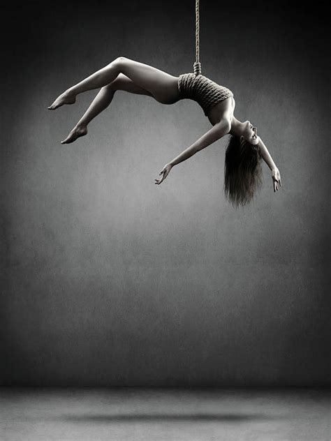 woman hanging on a rope art print by johan swanepoel