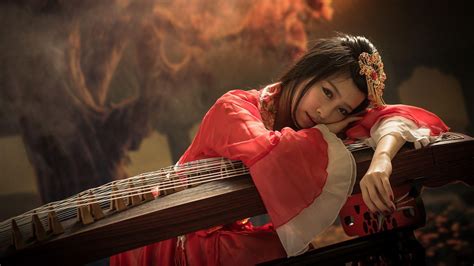 geisha leaning on the instrument hd desktop wallpaper