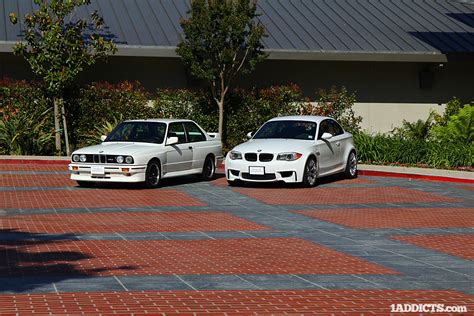photoshoot bmw 1m coupe poses with its muse the e30 m3