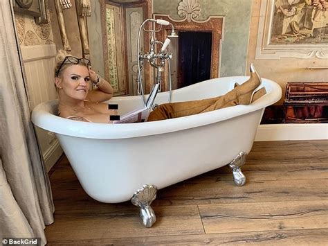 kerry katona poses topless as she writhes around in bubble bath for her