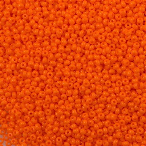 czech seed bead  opaque orange  aura crystals llc