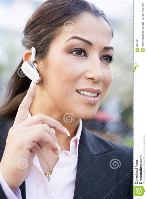 businesswoman  bluetooth earpiece stock photo image  twenties