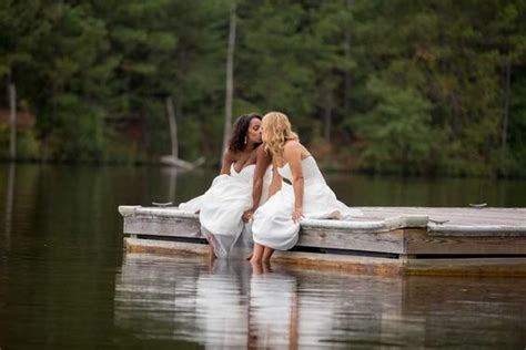 southern spring yellow and gray lesbian wedding two brides kiss on a lake real weddings gay