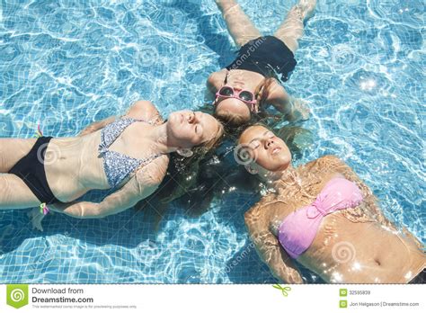 Three Girls Relaxing In The Pool Stock Image Image Of