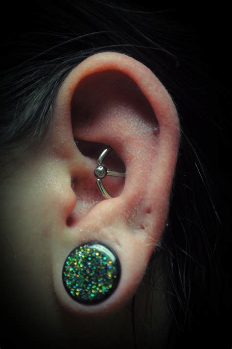conch orbital with a slave conch piercing piercings