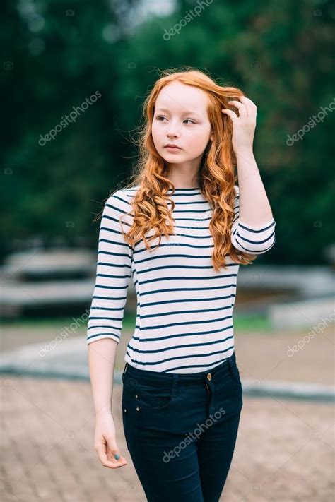 Outdoor Portrait Of Beautiful Girl With Long Curly Red