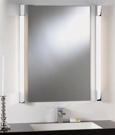 Square tube bathroom light for use around mirror. For use
