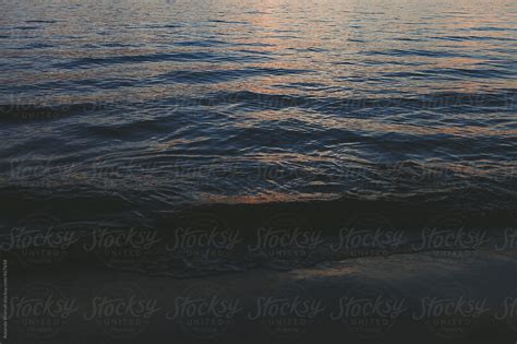 dark ripples at sunset del colaborador de stocksy amanda worrall