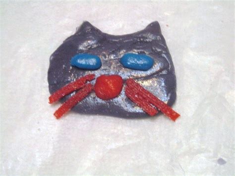 my cat i made using airheads candy i used about a half of a purple airhead to shape the face