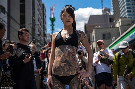 yakuza tattoos on show as men and women hit the streets of