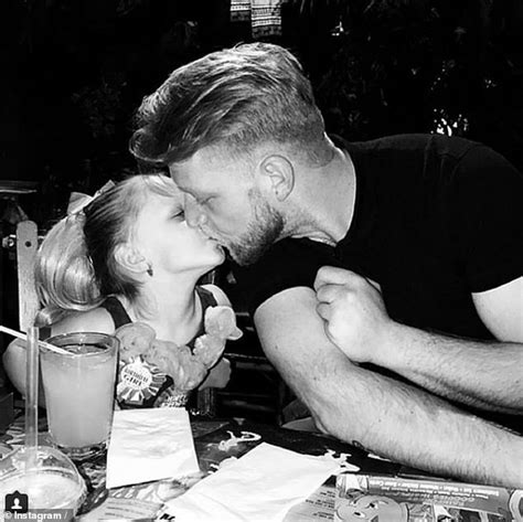 defiant dad posts viral photo of him kissing his daughter six on the