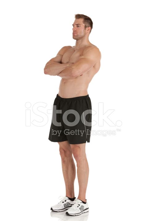 muscular man standing   arms crossed stock photo royalty