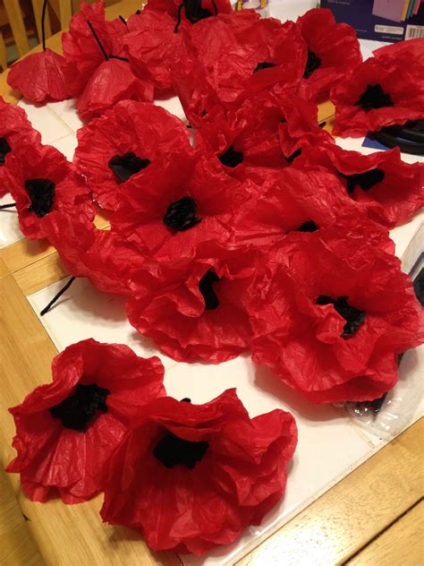 tissue paper poppies cut  large red circles  small black circles