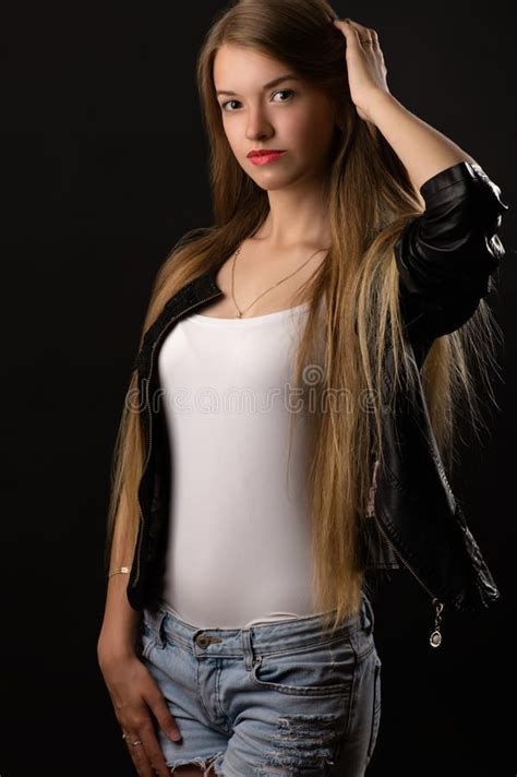 beautiful teenager girl in white shirt and jacket stock