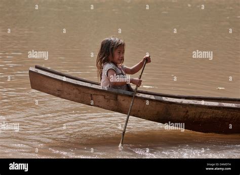 lanten girl in her dugout canoe on the nam ha river luang nam tha