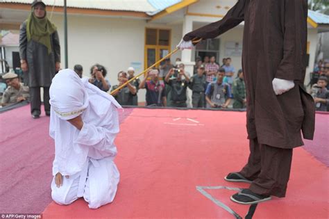 couple caned in indonesia for violating sharia law daily
