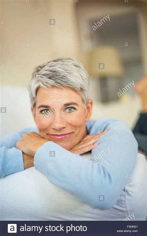 Portrait Of Beautiful Mature Woman With Short Grey Hair And Blue Eyes