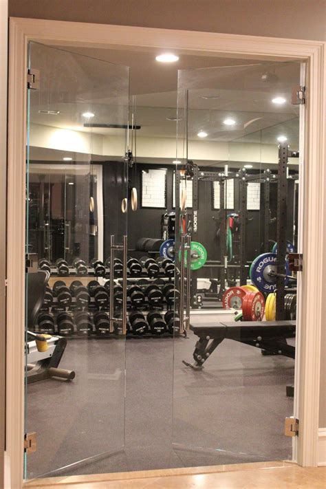 glass doors leading   home gym gym room  home home gym