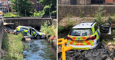 police car smashes through wall and into river during