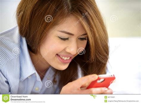 beautiful thai teen laughing with mobile phone stock image image of communication ipad 40775321