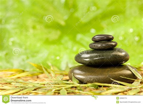 Spa Massage Hot Stones In Green Environment Stock Image