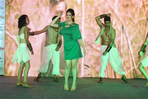 high quality bollywood celebrity pictures zareen khan displays her sexy legs in a green short