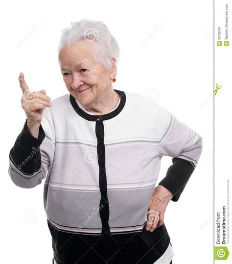 Portrait Of A Happy Old Woman Pointing Upwards Stock Image