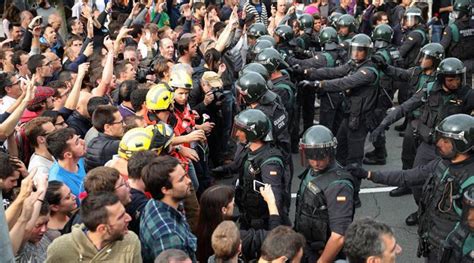 spanish police storm polling station in catalonia
