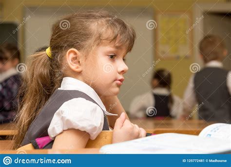 The Girl Is First Grader At The Break In The School Class Stock Image