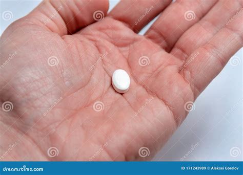 white oval pill   palm stock image image  cure pharmacology