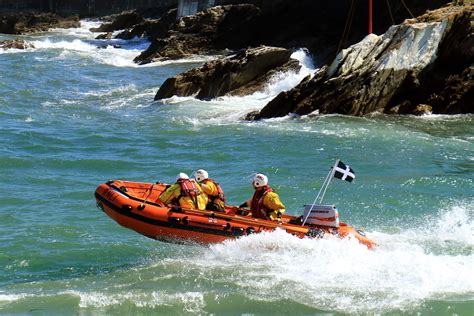 Looe Rnli Lifeboat Crew Rescue A Girl On An Inflatable Being Blown Out