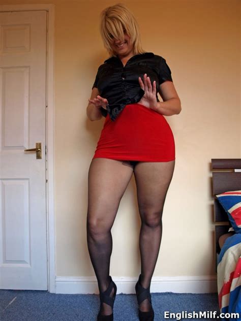 englishmilf in her high heeled pumps panties over her sheer pantyhose red mini skirt and blouse