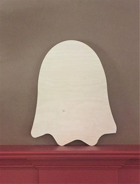 wooden cutout   ghost  top   red mantle   gray wall