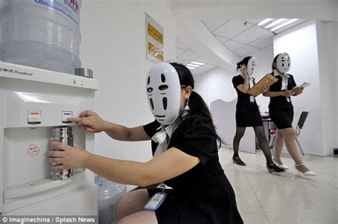 chinese employees wear masks from spirited away at work