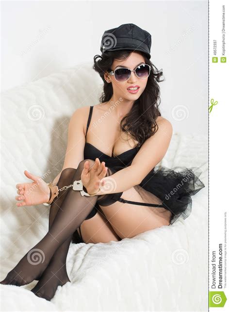 Sexy Woman With Handcuffs In Fashion Glasses