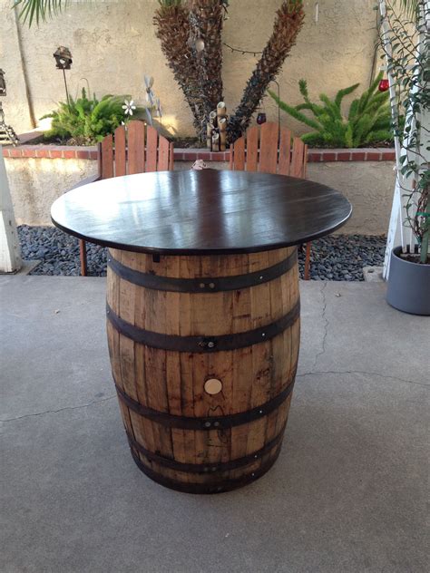 whiskey barrel turned into a backyard cocktail table whiskey barrel
