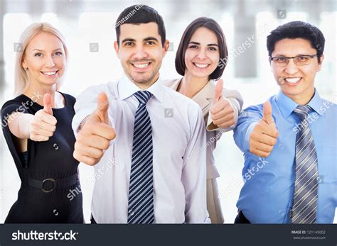 successful young business people showing thumbs  sign stock photo  shutterstock