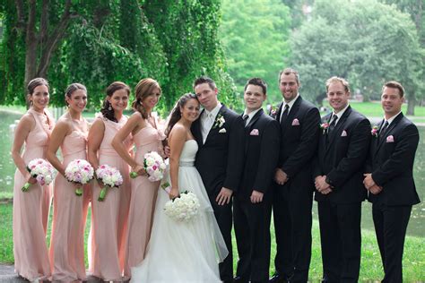 pale pink bridesmaids dresses  black groomsmen tuxedos