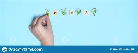 Woman Hand Pointing On Three Wooden Blocks Letters Sex On Them
