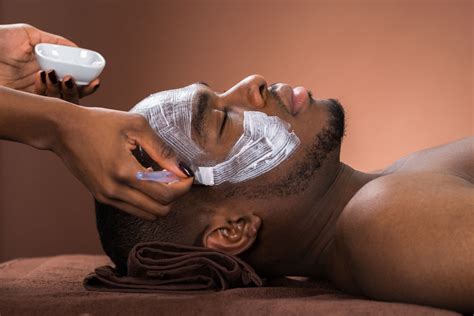 therapist applying face mask to man royalty free image 609094134
