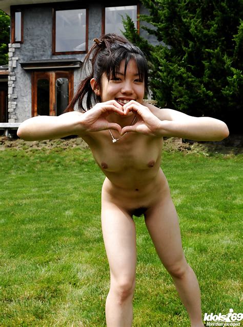 sweet asian teen babe with tiny tits posing naked and having fun outdoor