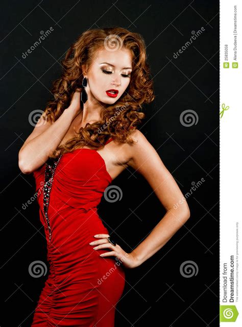 Beautiful Daring Red Haired Girl In A Red Dress Royalty