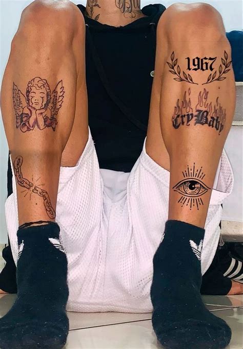 men  tattoos   legs sitting