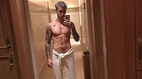justin bieber shows off new purple hair and insane abs in series of nearly naked selfies
