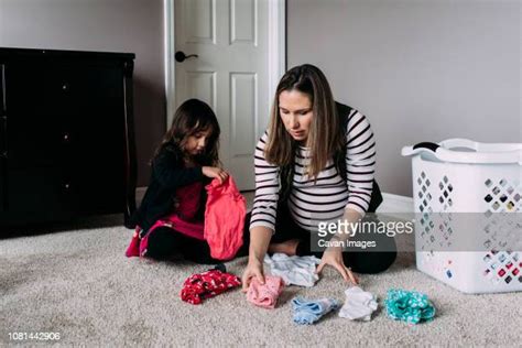 pregnant mom laundry photos and premium high res pictures getty images