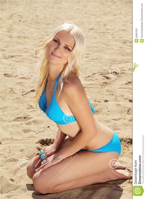 Blond Woman Sunbathing On Beach Royalty Free Stock