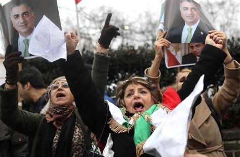 opponents of iranian president hassan rouhani hold a