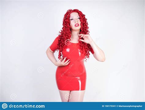 Hot Sexual Redheaded Girl With Plus Size Body Wears Fashion Latex